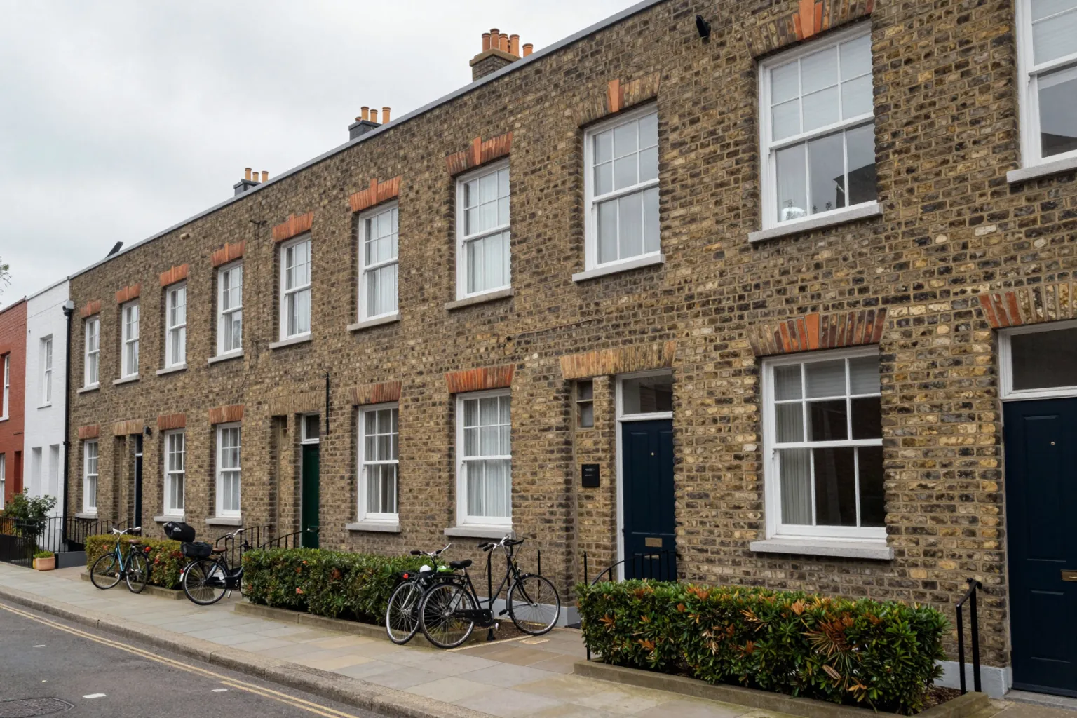AI exterior render of a brick townhouse row with green front gardens